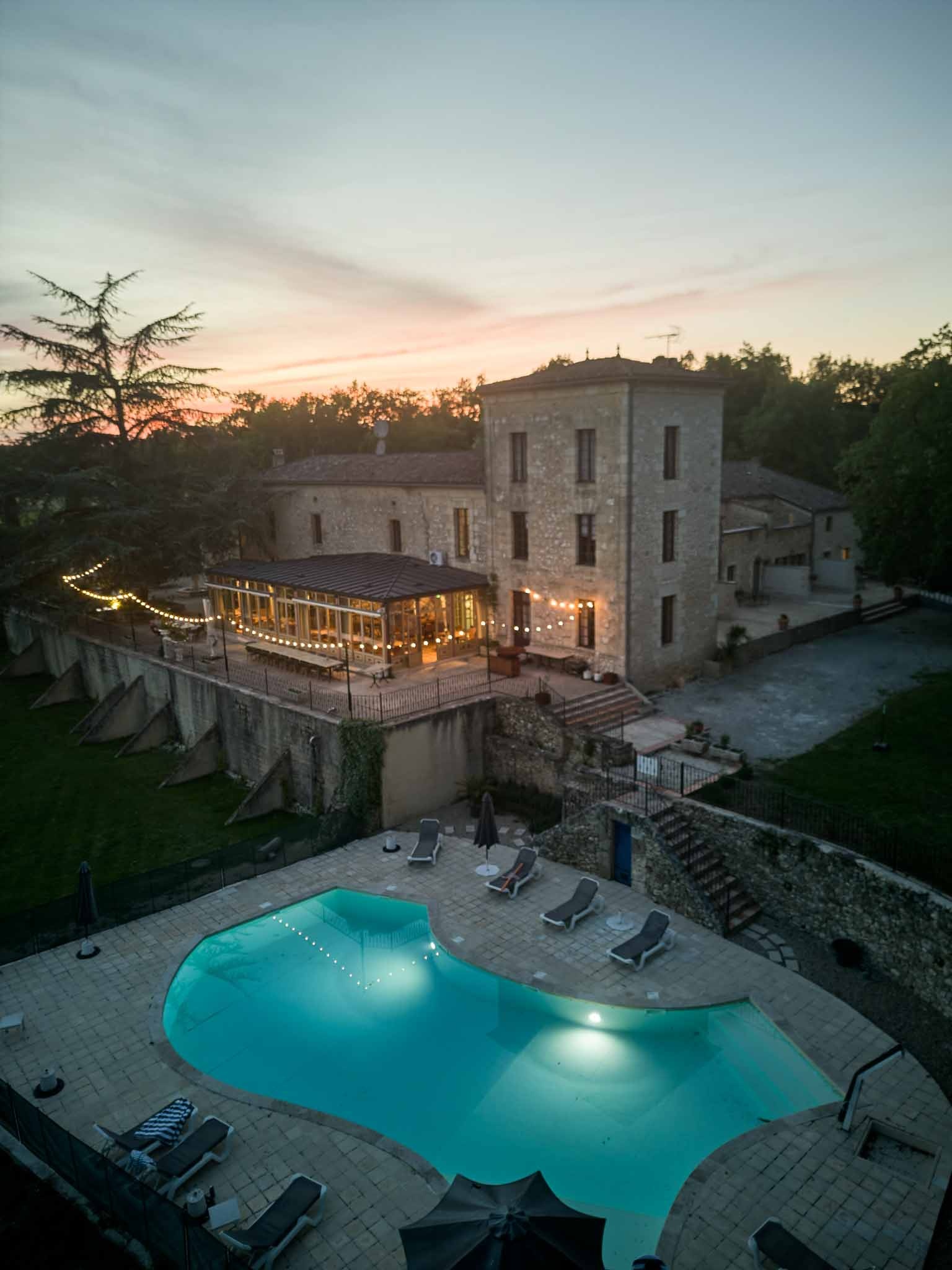 Château de Sanse and its pool at sunset, among the hills of the Gironde