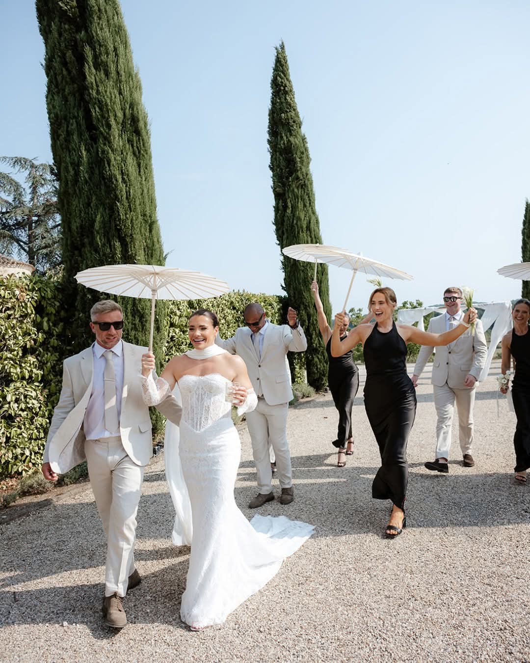 Bride arriving with her father and bridesmaids