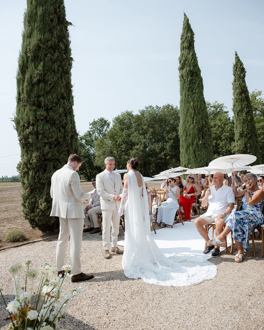 Couple exchanging vows among cypress trees