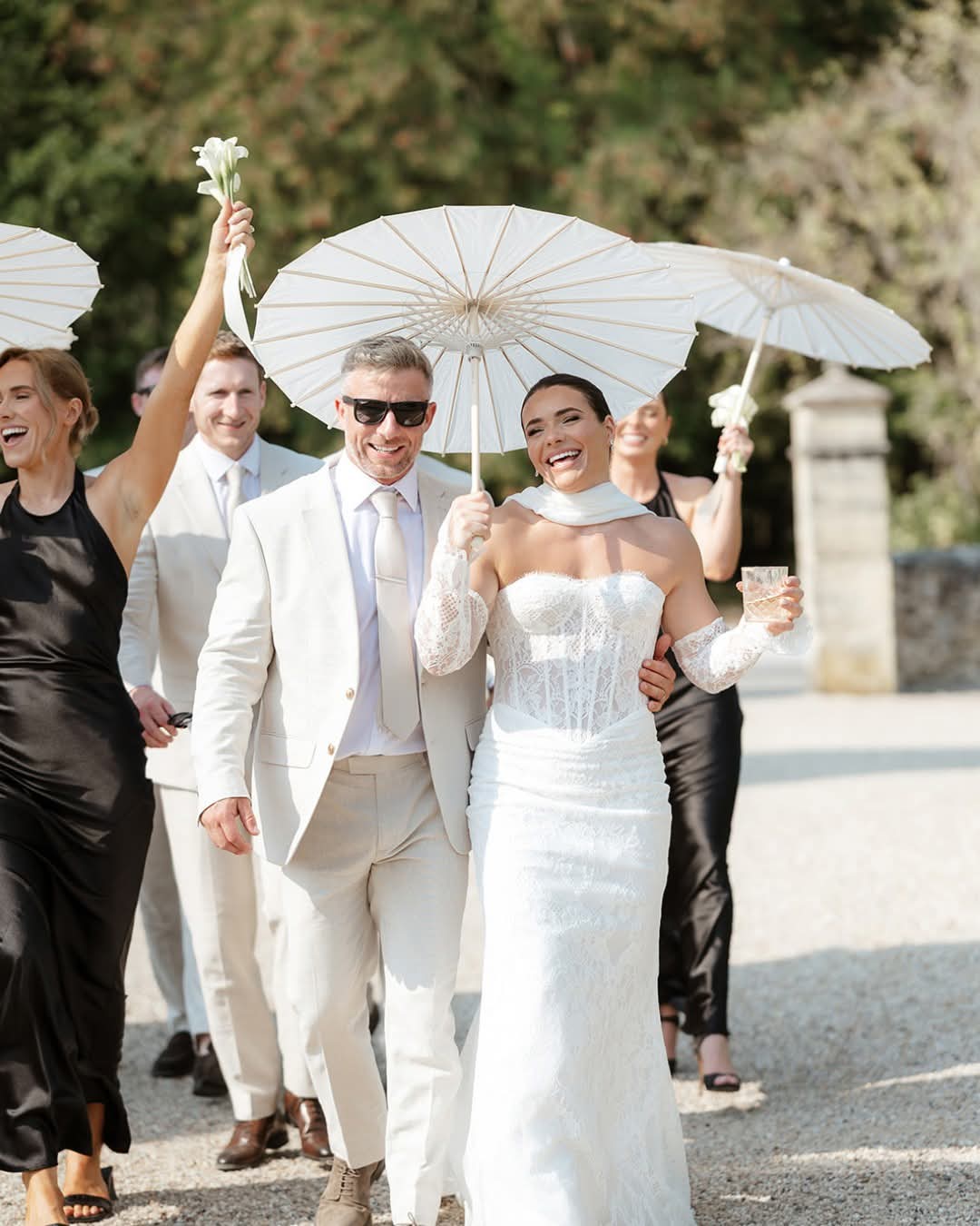 Bride and groom celebrating with their wedding party