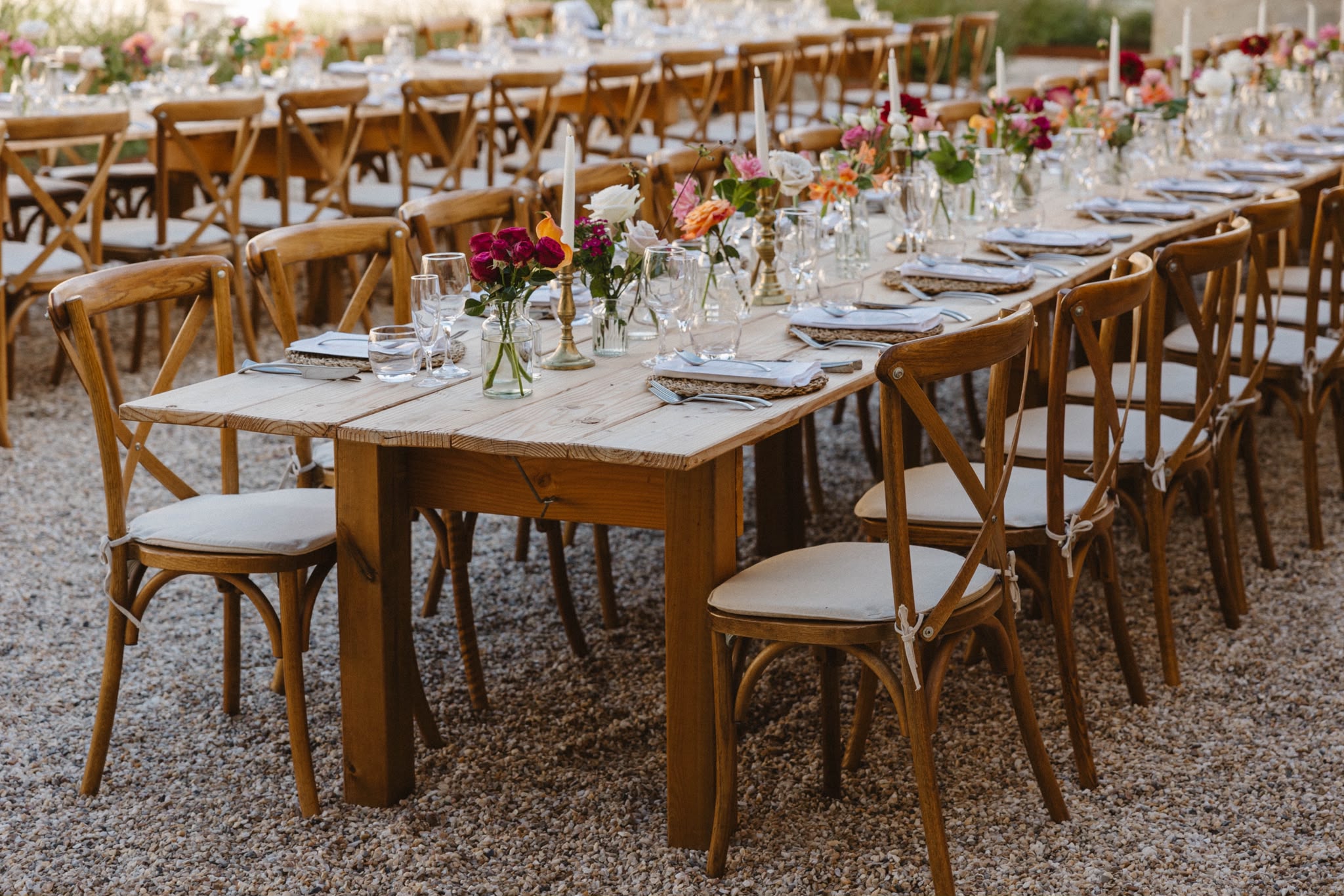 Long reception table set with flowers