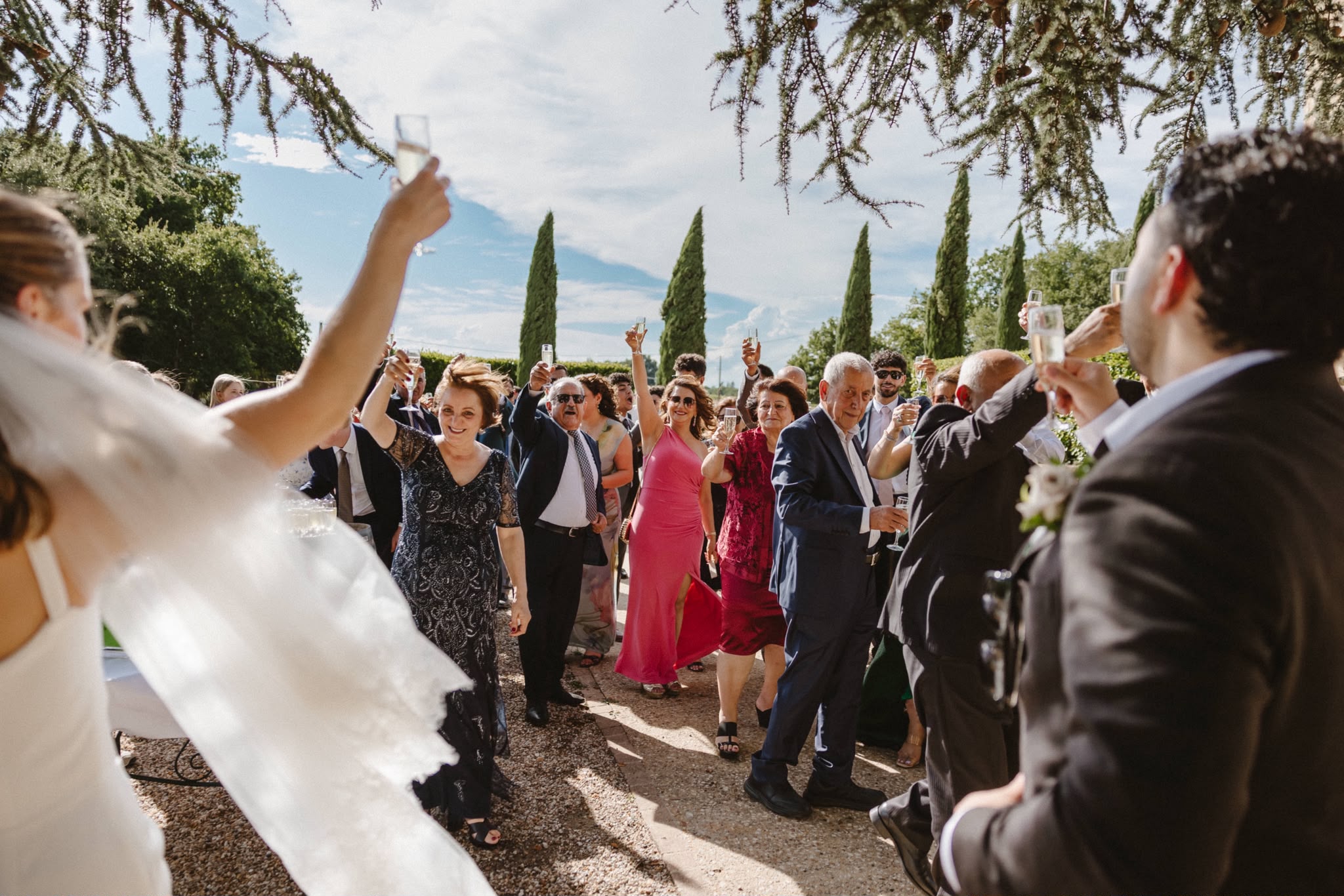 Guests cheering as the couple arrive