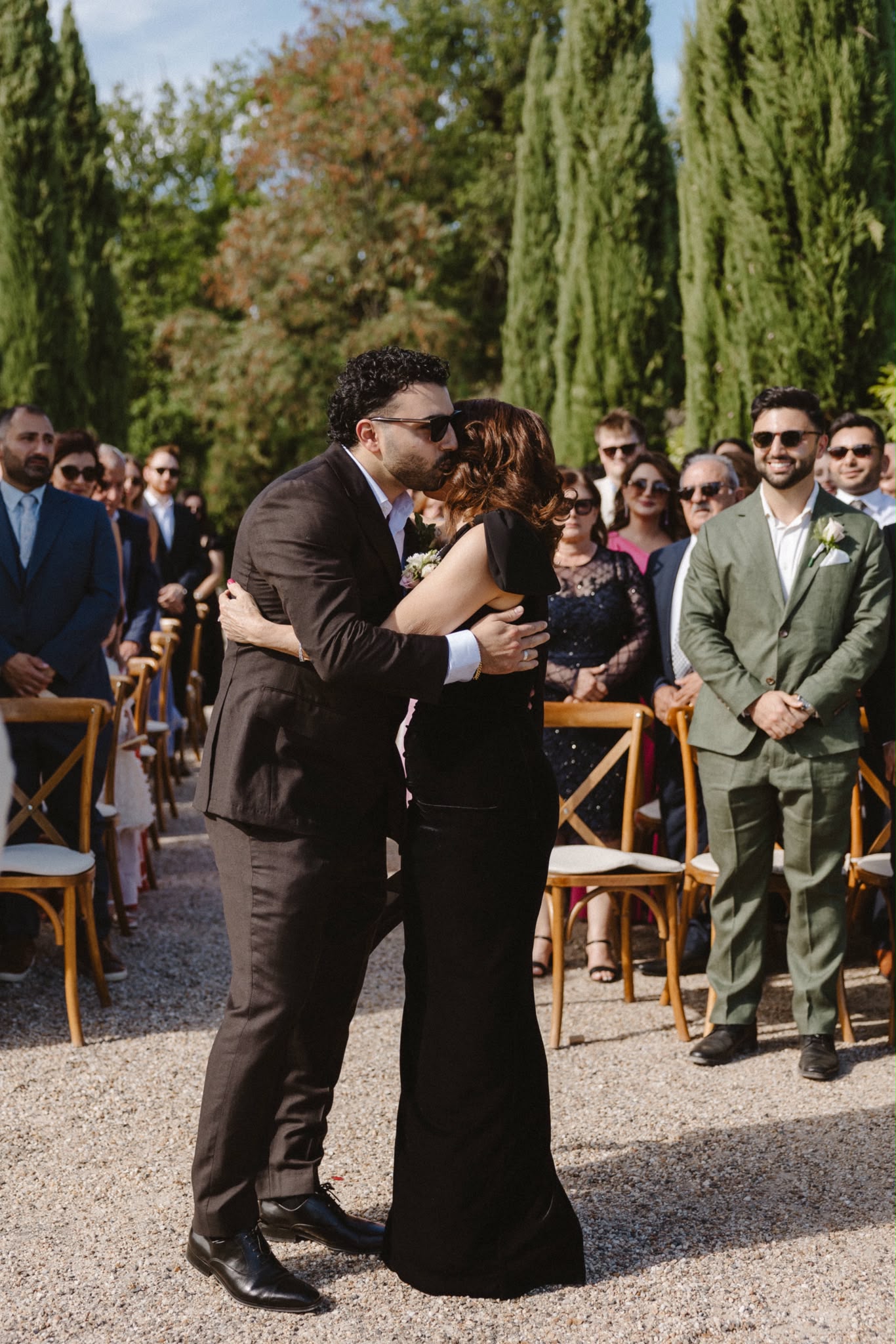 Guests embracing at the wedding celebration